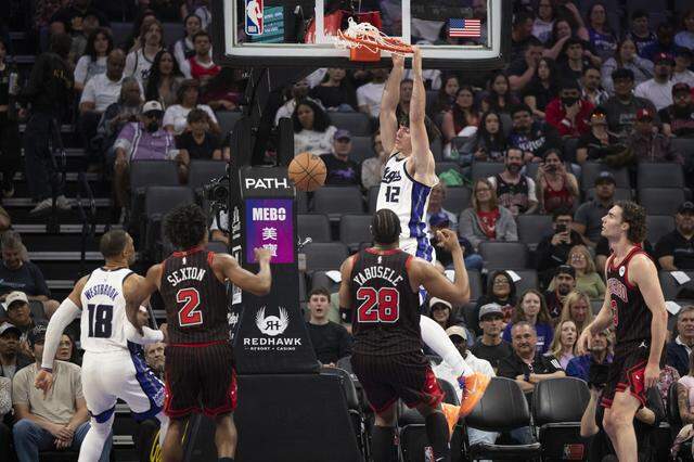 Sacramento Kings center Maxime Raynaud (42) dunks during a game at Golden 1 in Sacramento on Sunday, March 8, 2026.